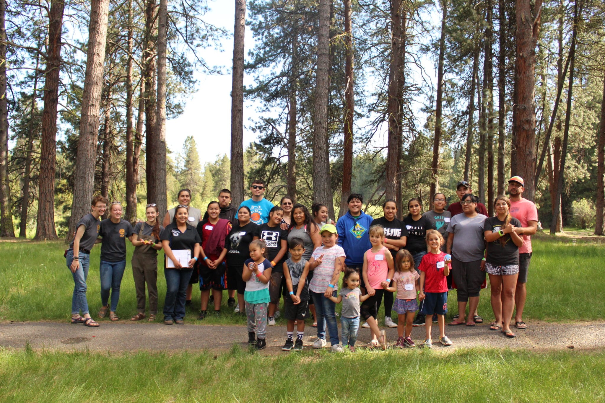 SSP staff and Chiloquin community members gathered in a forest outside of Chiloquin.