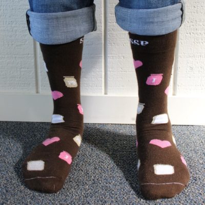 Brown PB&J socks with jars, hearts, and slices of bread.