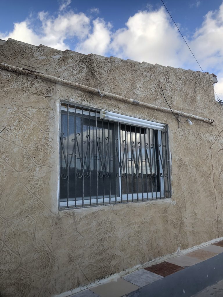 A window into Omar's house, one of the few homes in the area unoccupied by Israeli settlers.